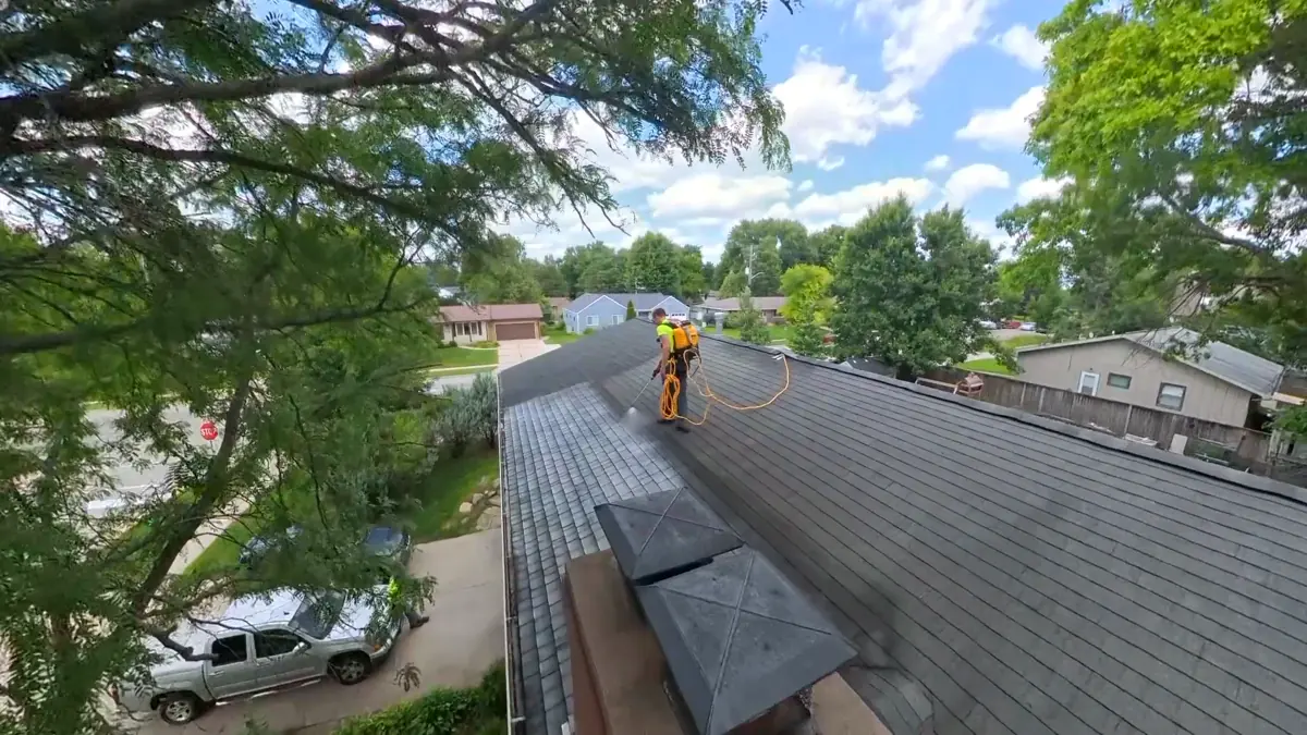 Aerial view of a home during rejuvenation with work truck parked below
